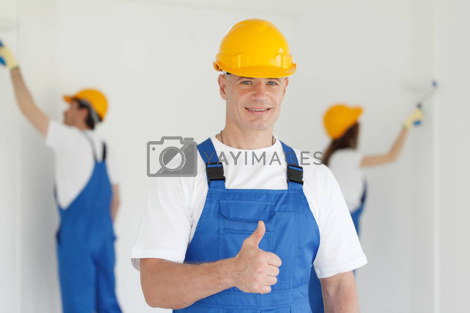 Royalty free image of Workman gives thumbs up by ALotOfPeople