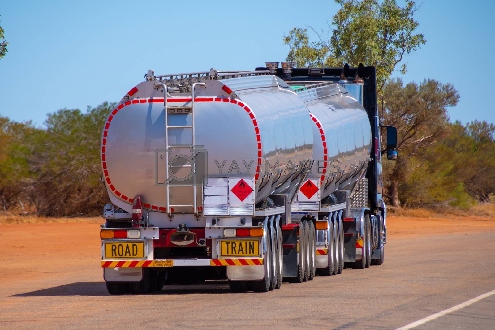 Royalty free image of Back side of road train transporting gasoline in Australian Outback by MXW_Stock