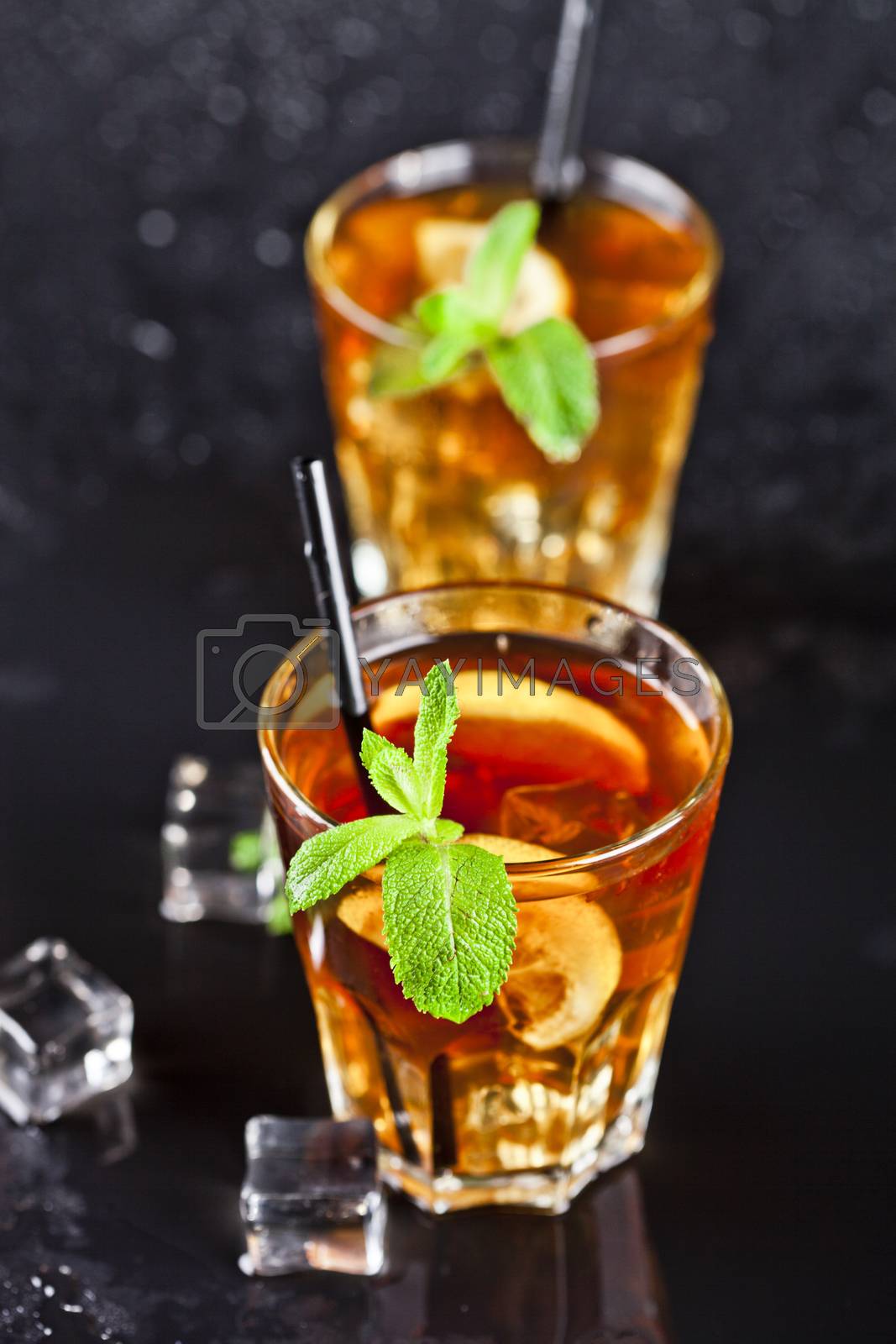 Royalty free image of Two glasses with cold traditional iced tea with lemon, mint leav by marylooo