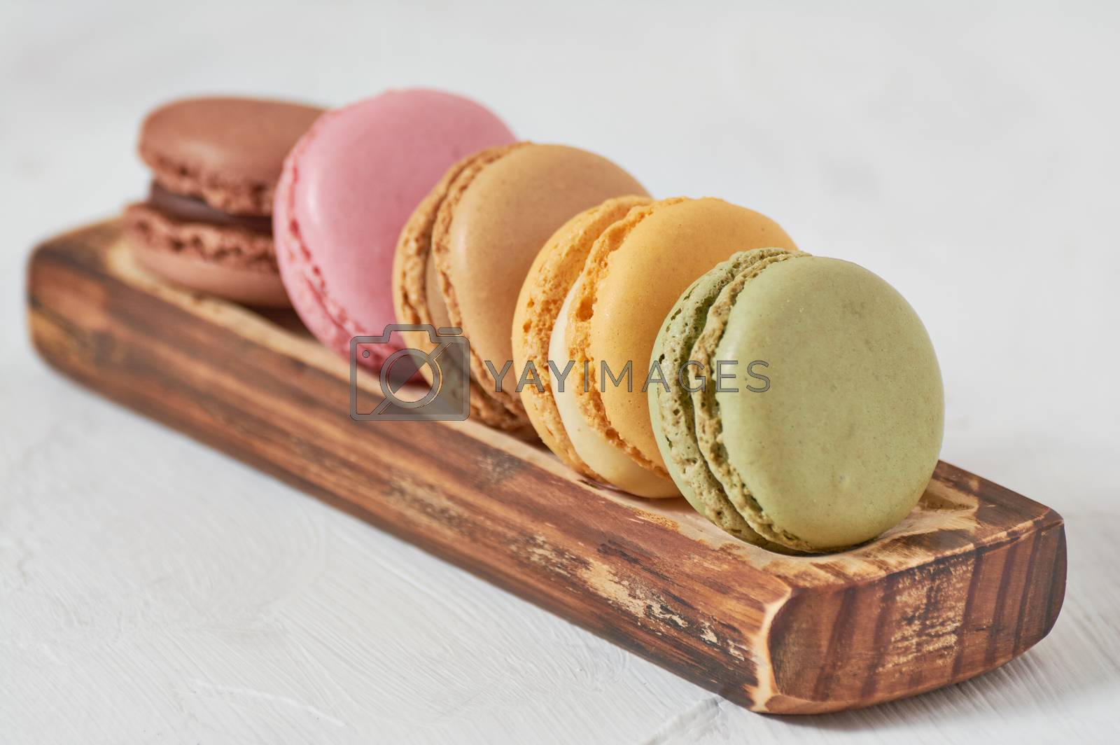 Royalty free image of breakfast of macarons wooden splint by Prf_photo