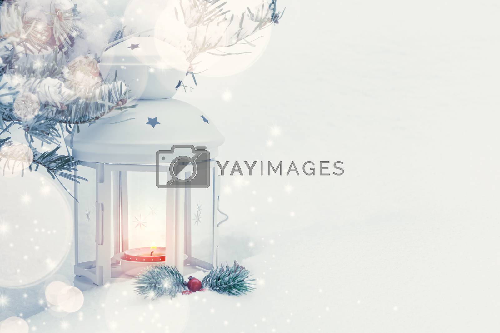 Royalty free image of Christmas composition - a lantern with a burning candle and decorations under the Christmas tree, copy space, place for text by galsand