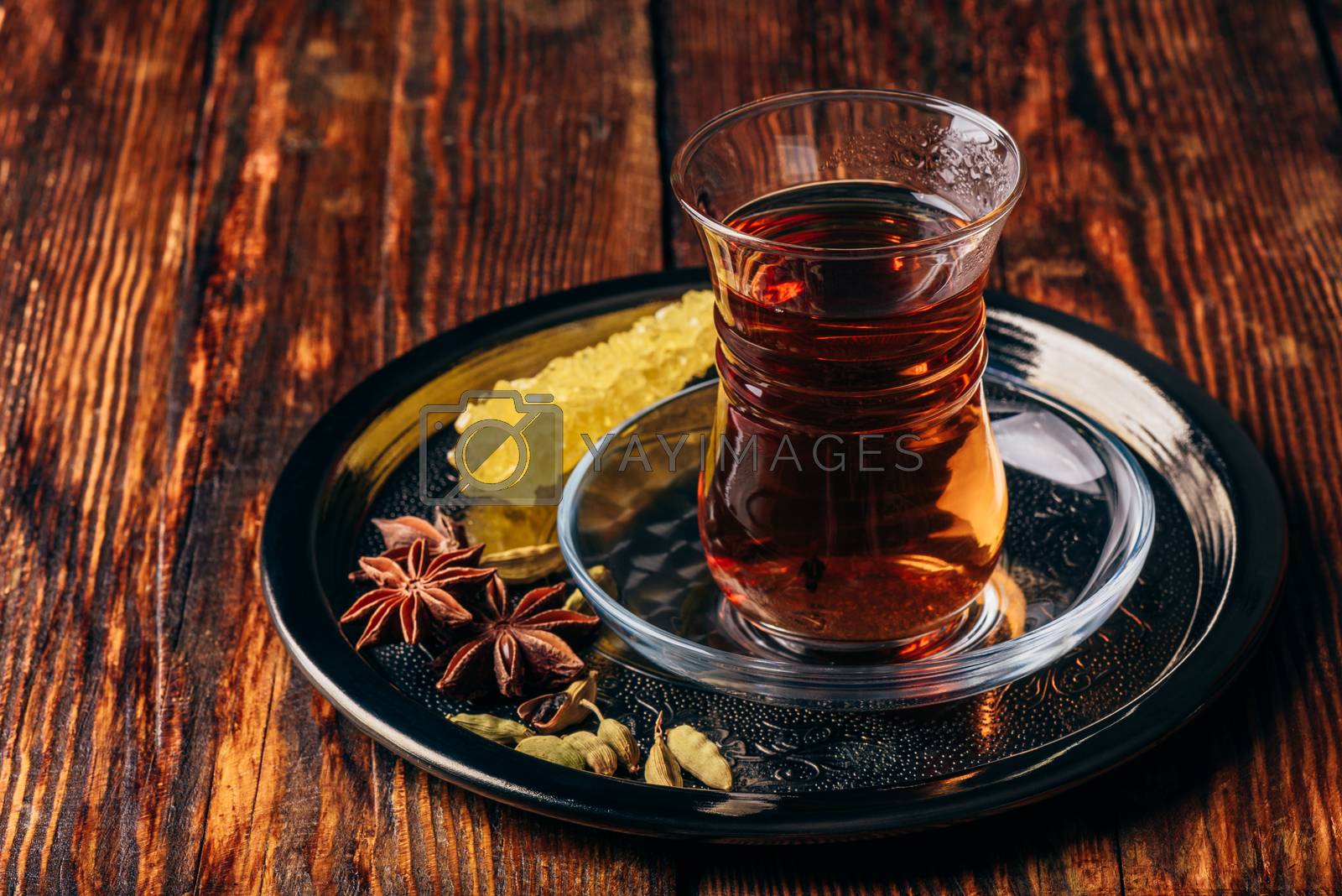 Royalty free image of Spiced tea in armudu with crystal sugar by Seva_blsv