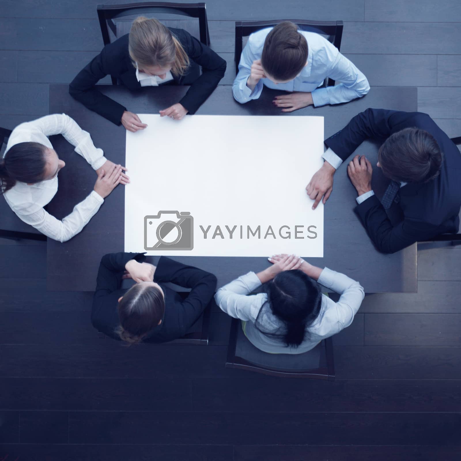 Royalty free image of Business people and blank paper by ALotOfPeople