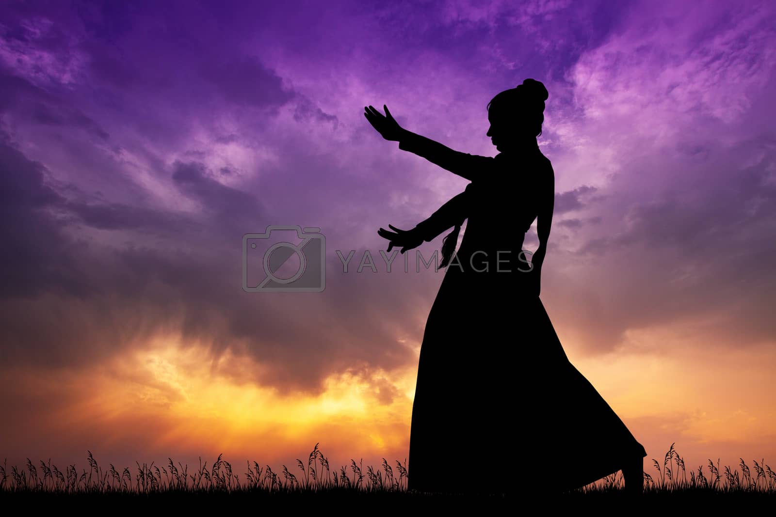 Royalty free image of Indian dance at sunset by adrenalina