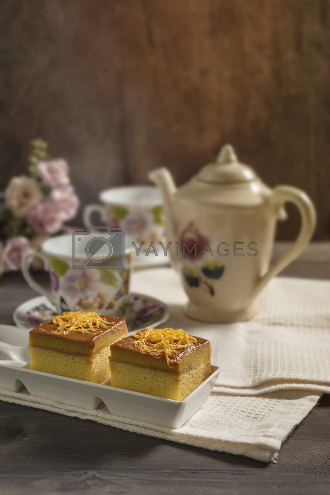 Royalty free image of hot tea and sweet cake by rakratchada