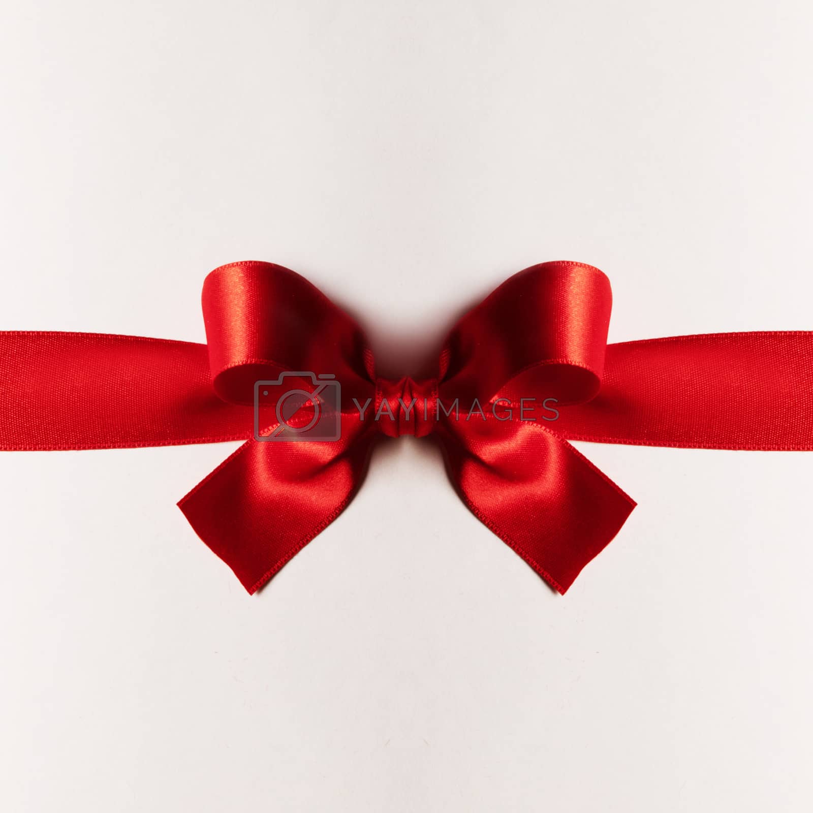 Royalty free image of Red gift bow on white by Yellowj