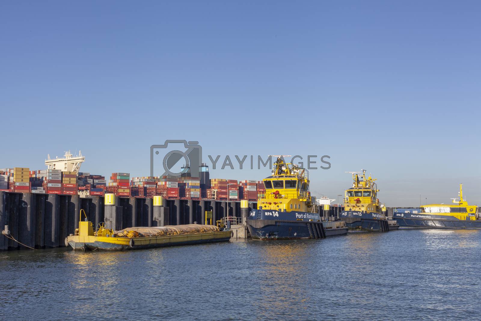 Royalty free image of Fire fighting boats, port of Rotterdam are docked on the side of by Tjeerdkruse