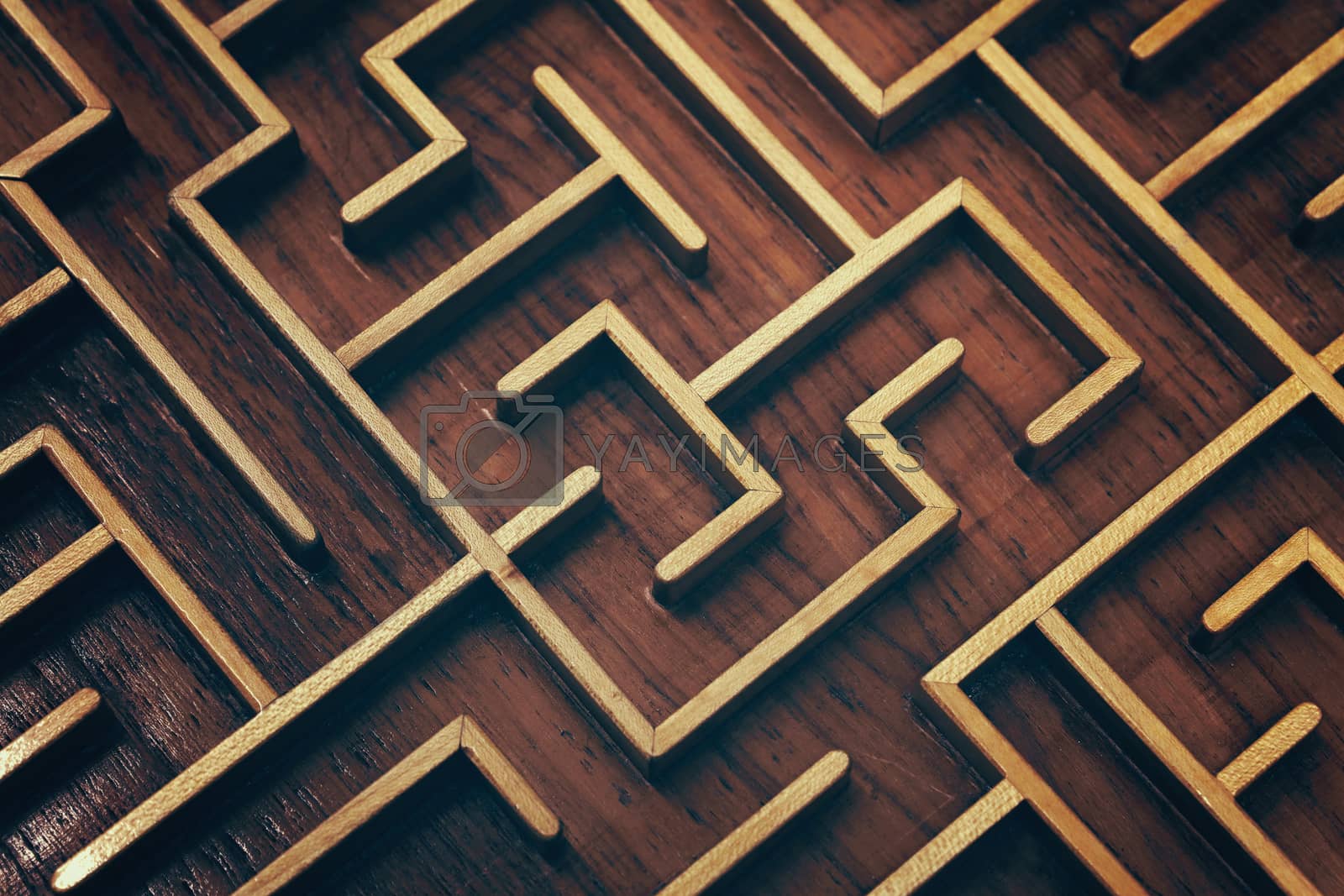 Royalty free image of Wooden brown labyrinth maze puzzle close up by BreakingTheWalls