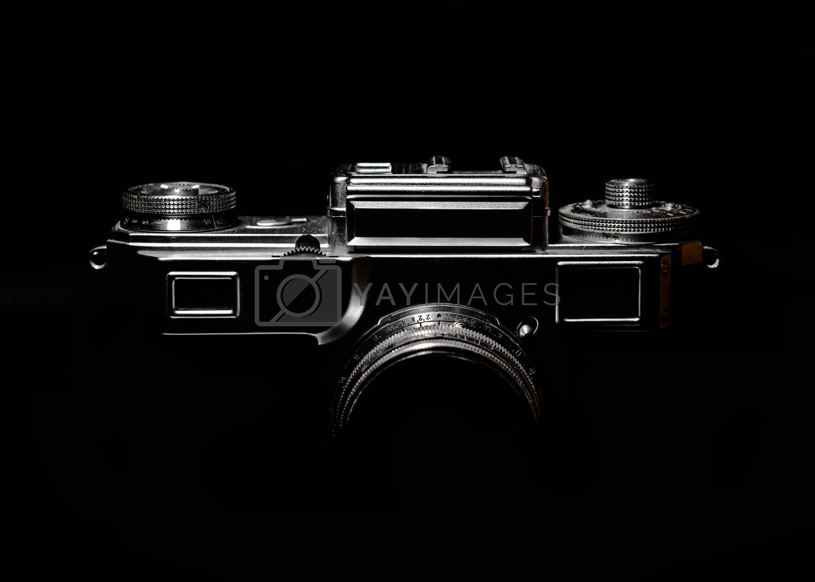 Royalty free image of contour of a vintage camera in the dark by Gera8th