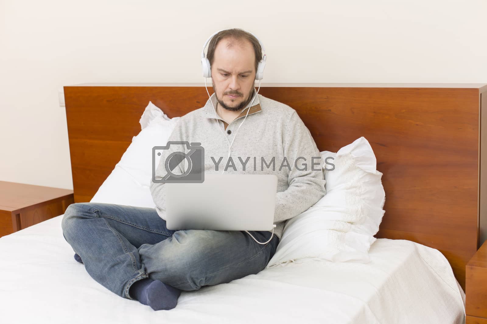 Royalty free image of working in bed by zittto