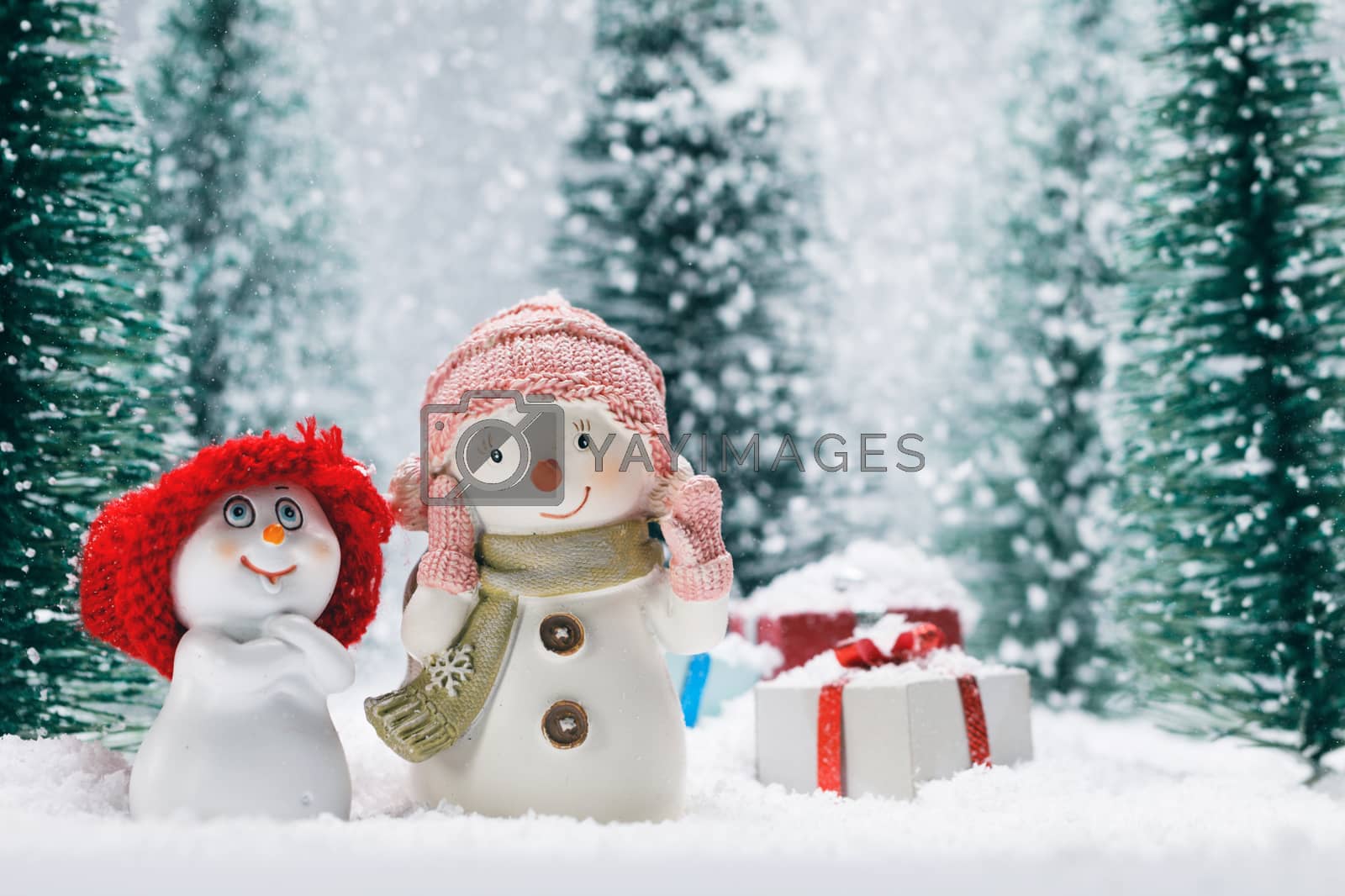Royalty free image of Snowmen and gifts by Yellowj