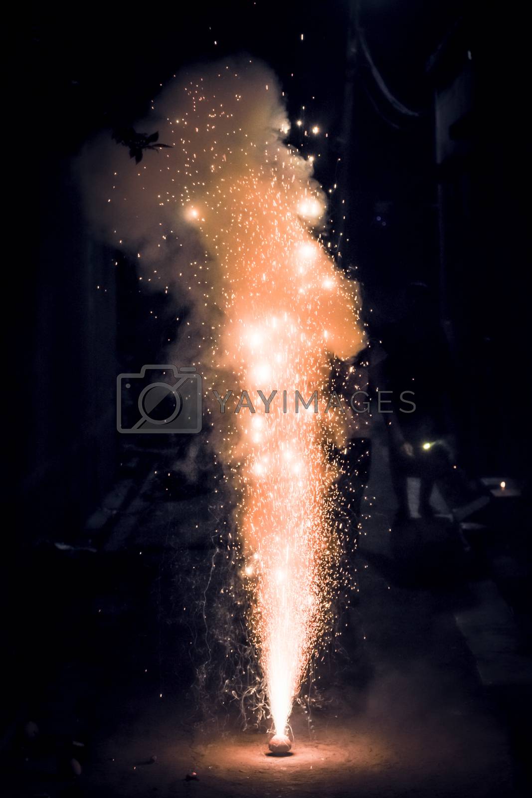 Royalty free image of Bright and colorful fireworks showing display at night in City Street during Diwali festival celebration in Kolkata India. Close-up. Copy space room for text. by sudiptabhowmick