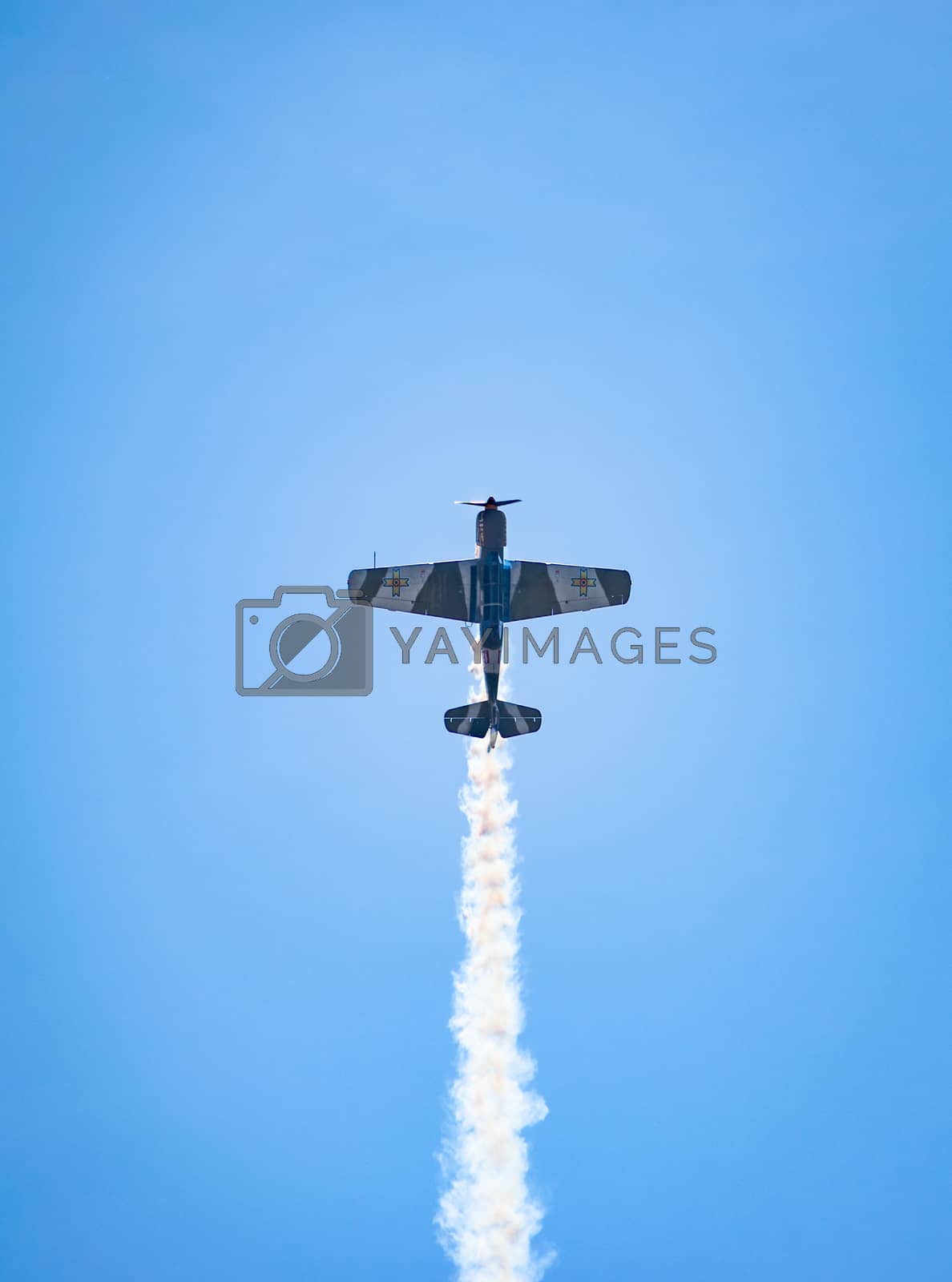 Royalty free image of Bucharest/ Romania - AeroNautic Show - September 21, 2019: YAK 52TW Airplanes flying trough the sky by Luca-Mih
