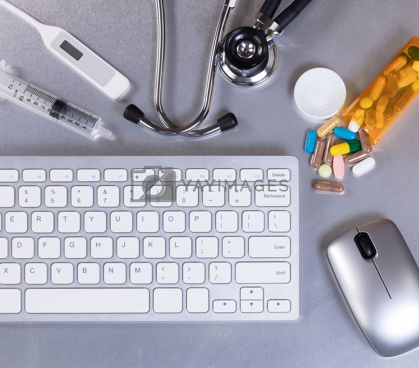 Royalty free image of Stainless steel desktop with medical doctor equipment and comput by tab1962