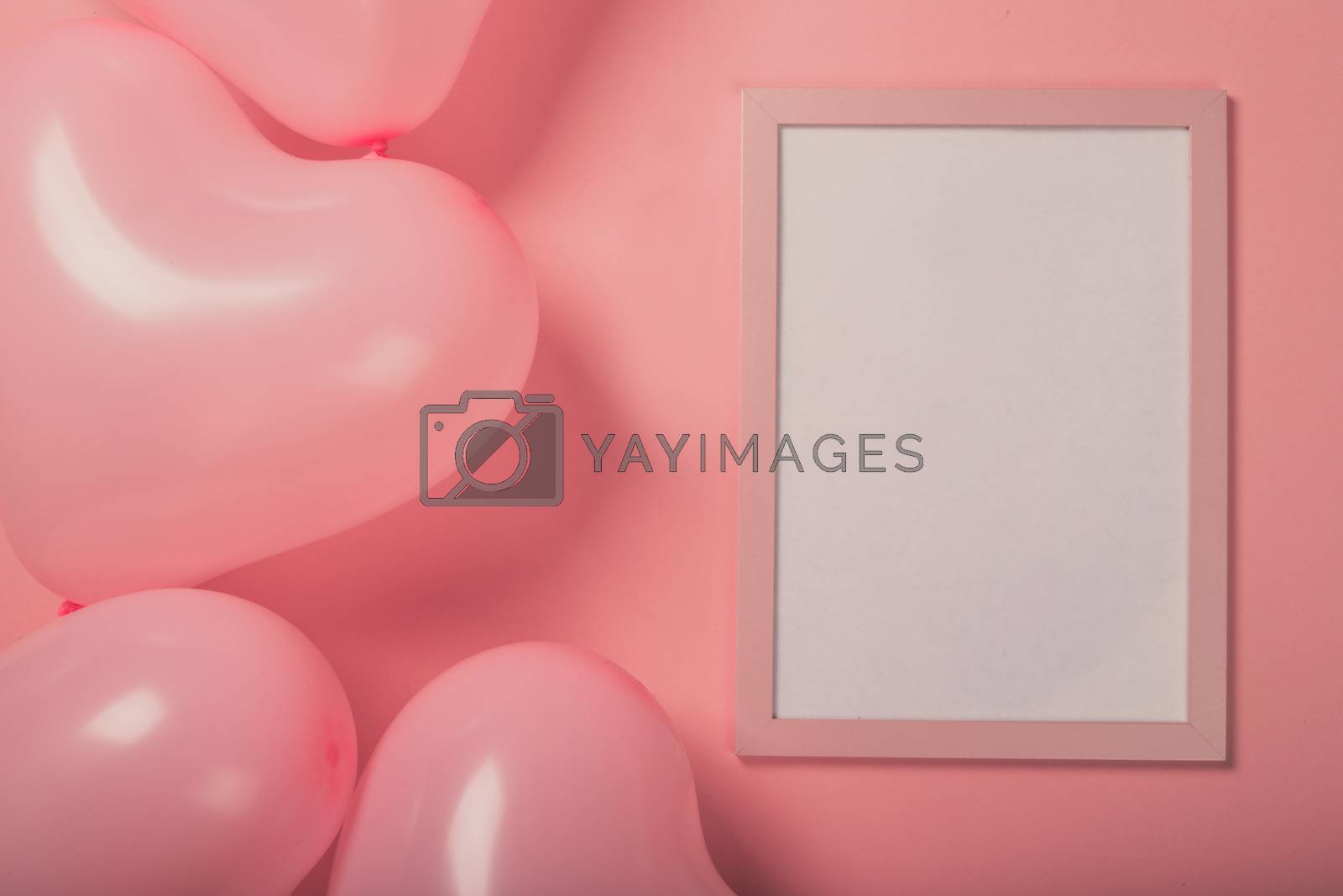 Royalty free image of Valentine day balloons and frame by destillat