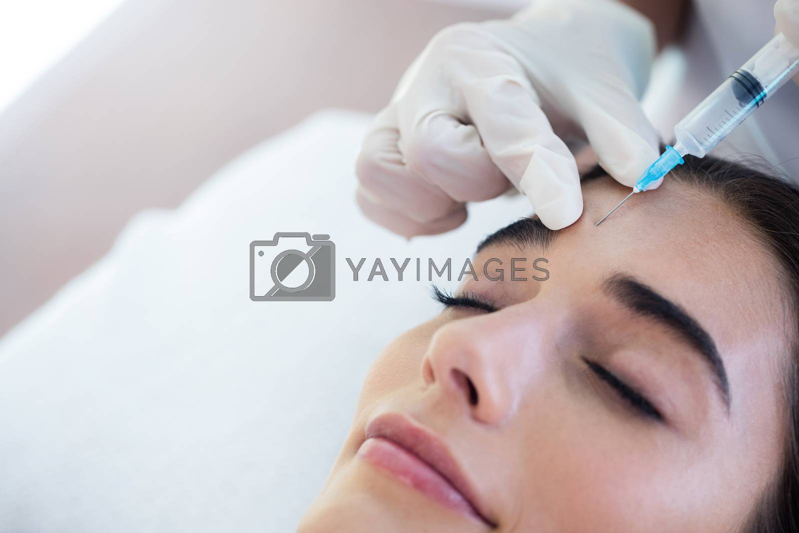 Royalty free image of Woman receiving botox injection  by Wavebreakmedia