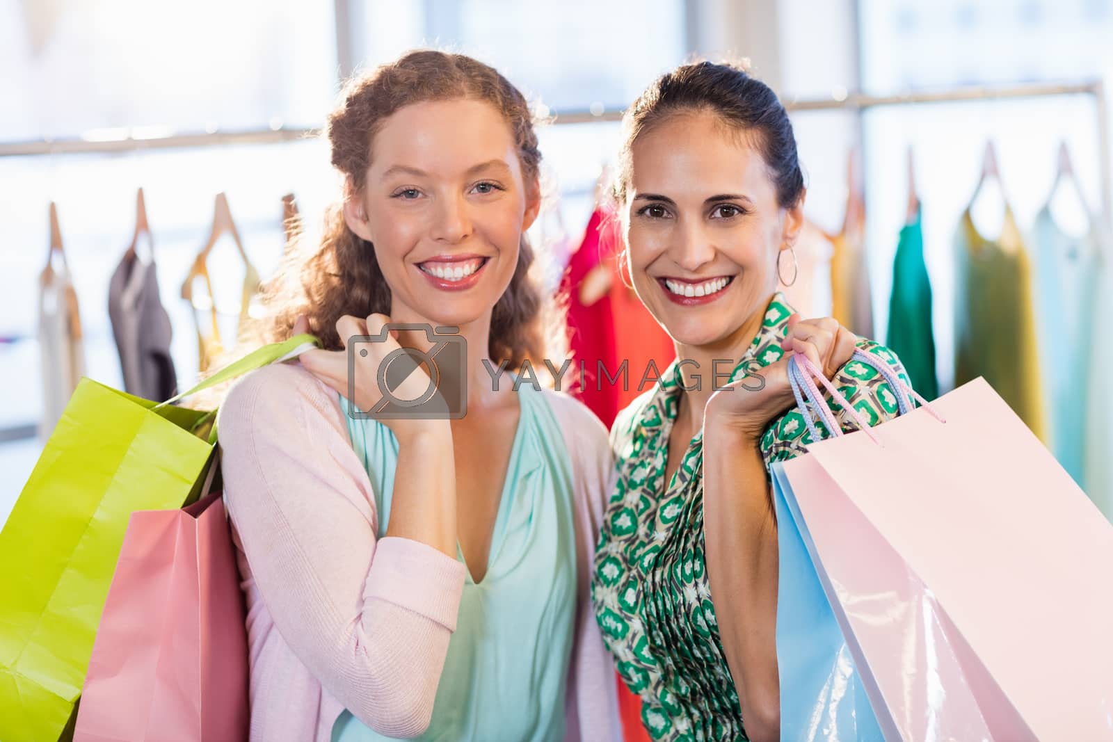 Royalty free image of  Females friends with shopping bags by Wavebreakmedia
