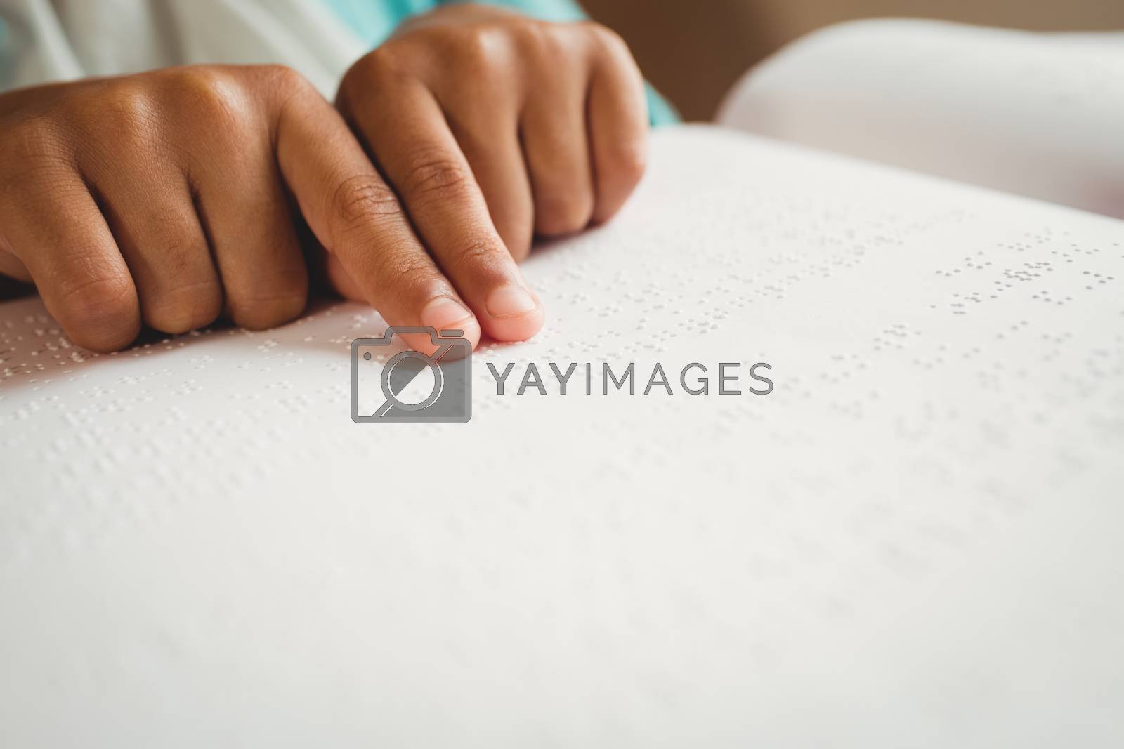 Royalty free image of Girl using braille to read by Wavebreakmedia