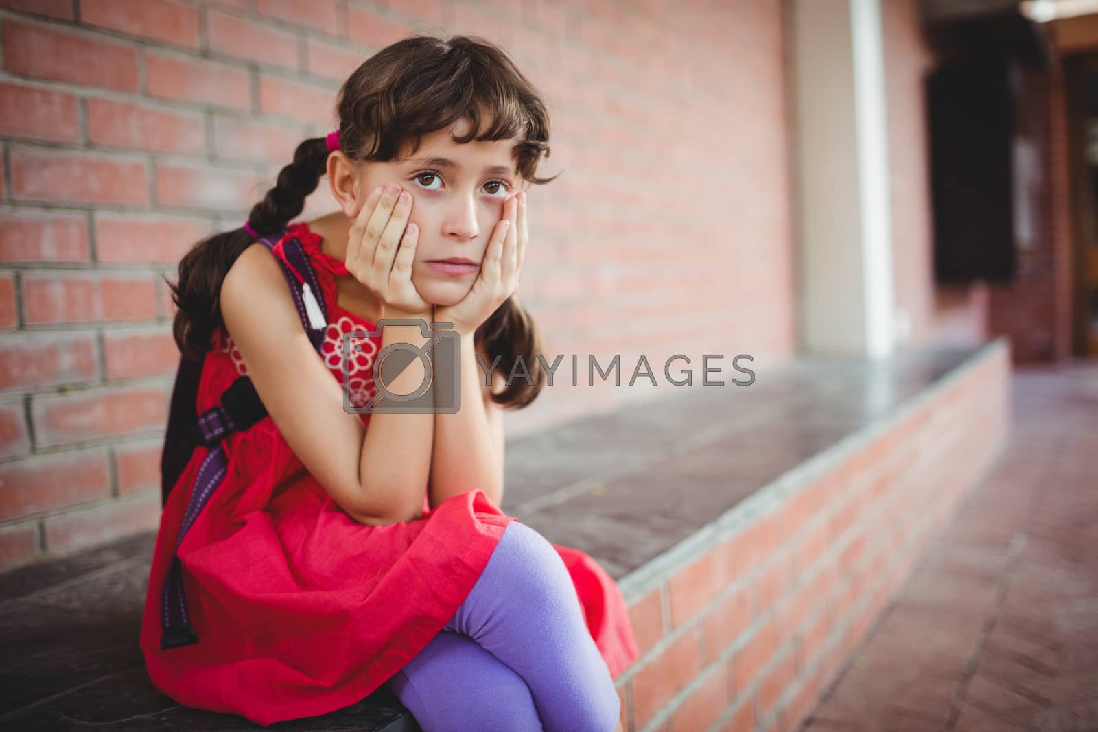 Royalty free image of Girl holding her cheek by Wavebreakmedia