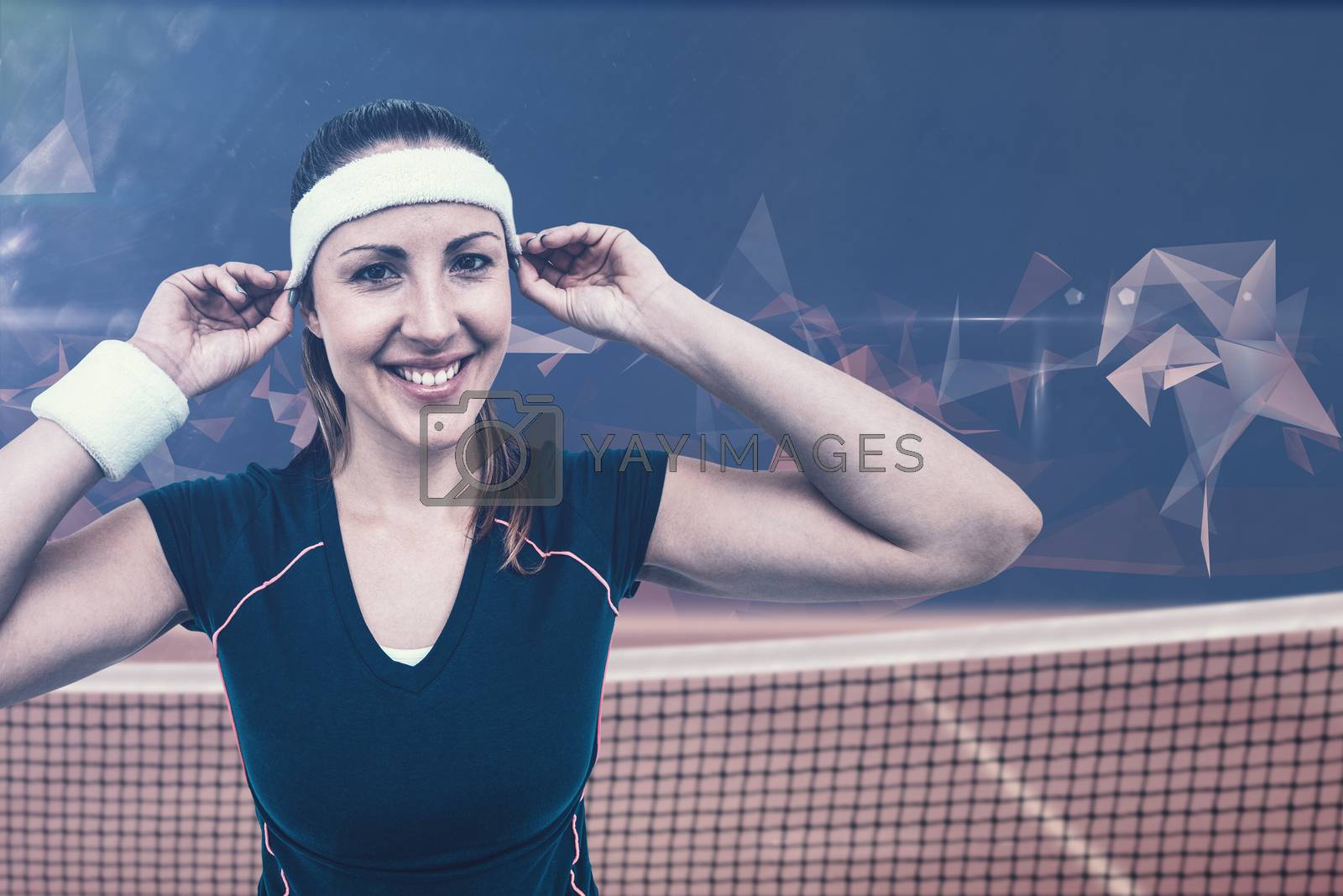 Royalty free image of Composite image of female athlete wearing headband and wristband by Wavebreakmedia