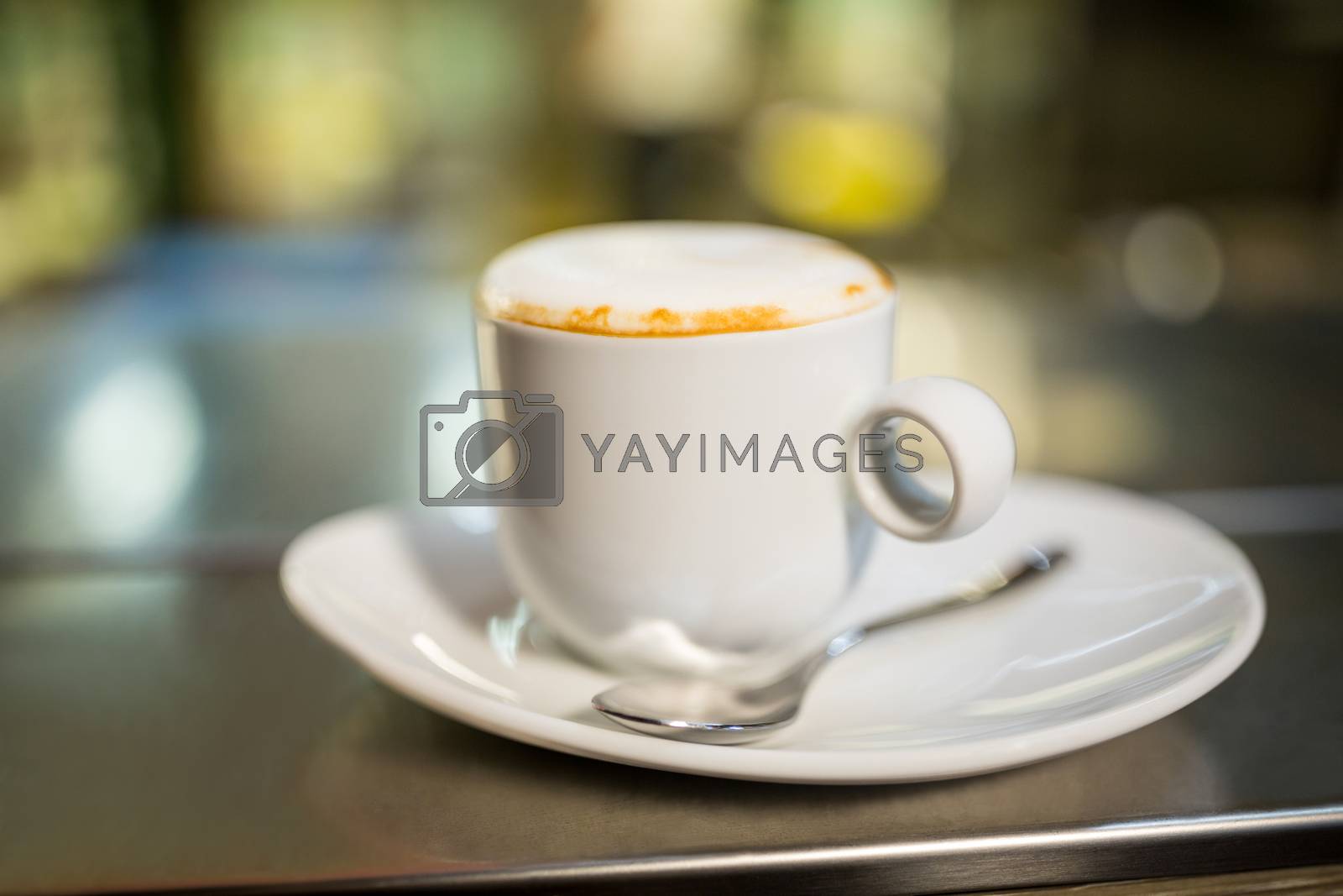 Royalty free image of Close-Up of coffee cup by Wavebreakmedia