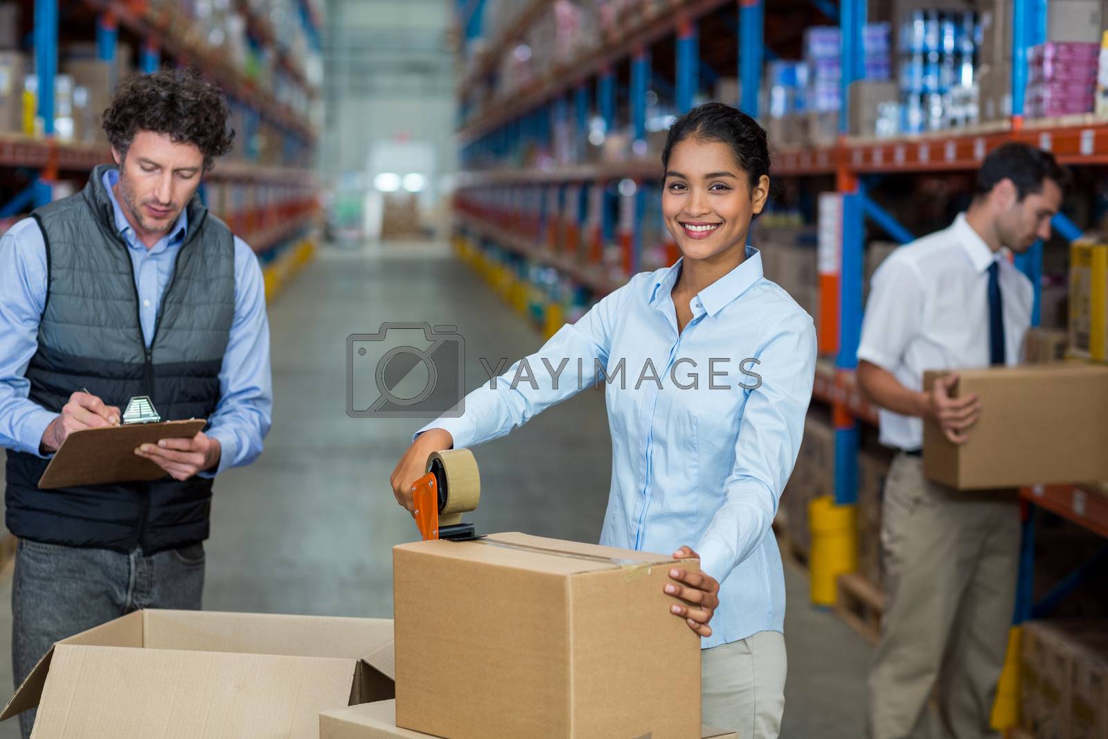 Royalty free image of Focus of manager is smiling and posing during work with his colleagues by Wavebreakmedia