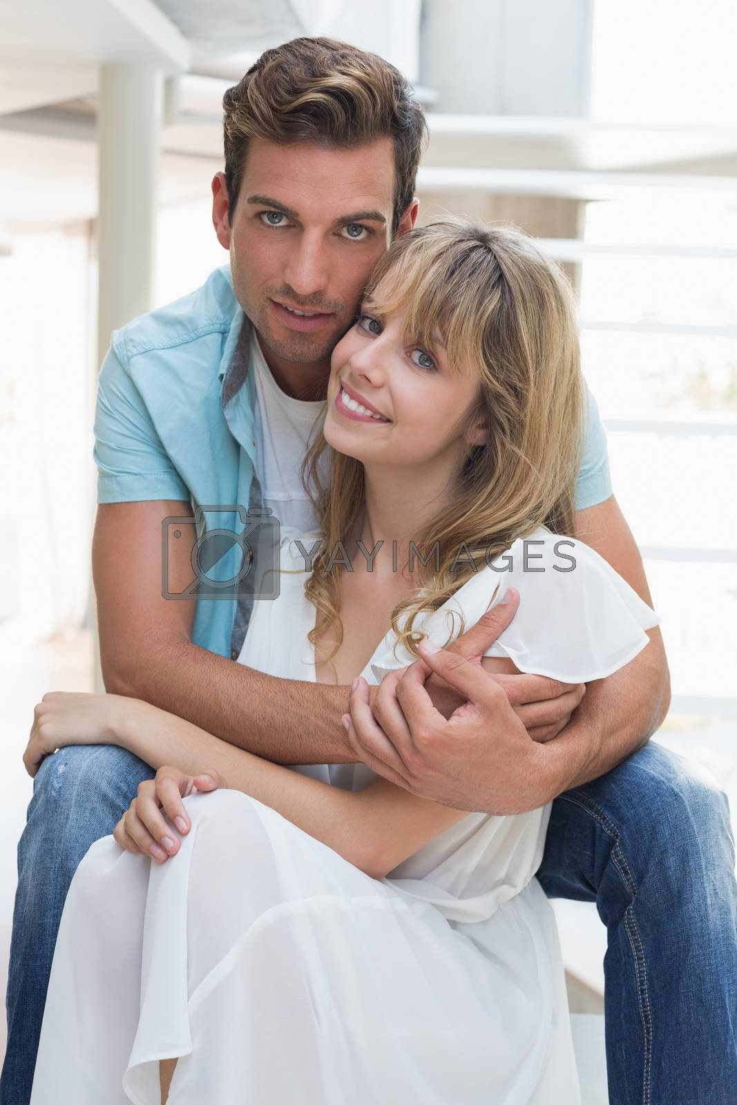 Royalty free image of Loving young man embracing woman by Wavebreakmedia