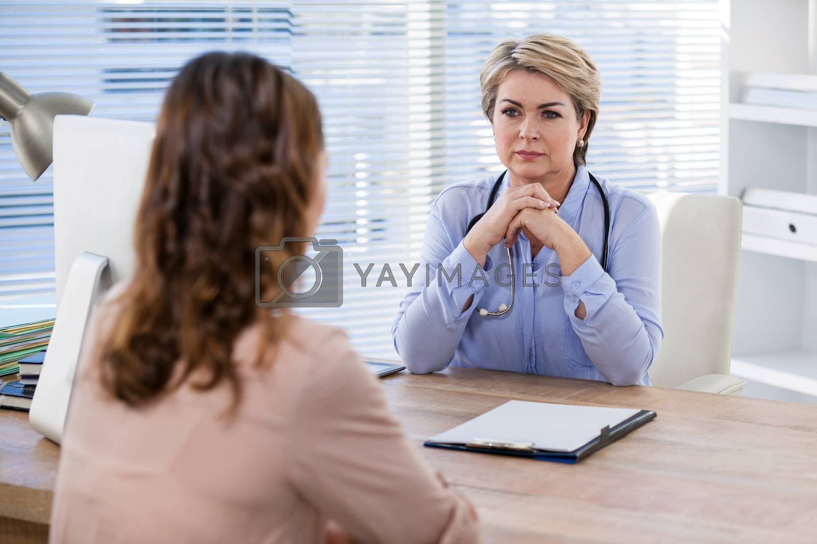 Royalty free image of Patient consulting a doctor by Wavebreakmedia