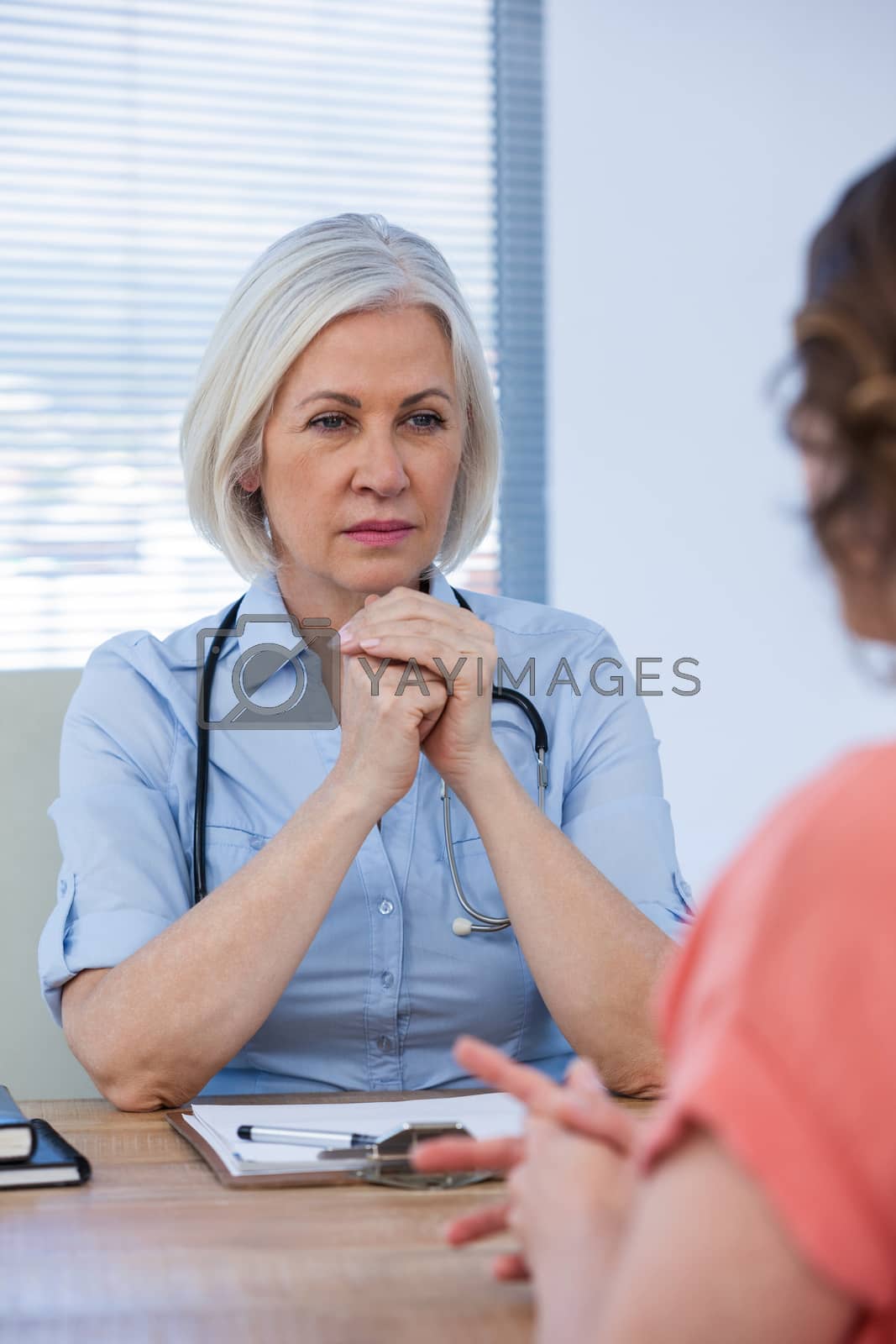 Royalty free image of Patient consulting a doctor by Wavebreakmedia