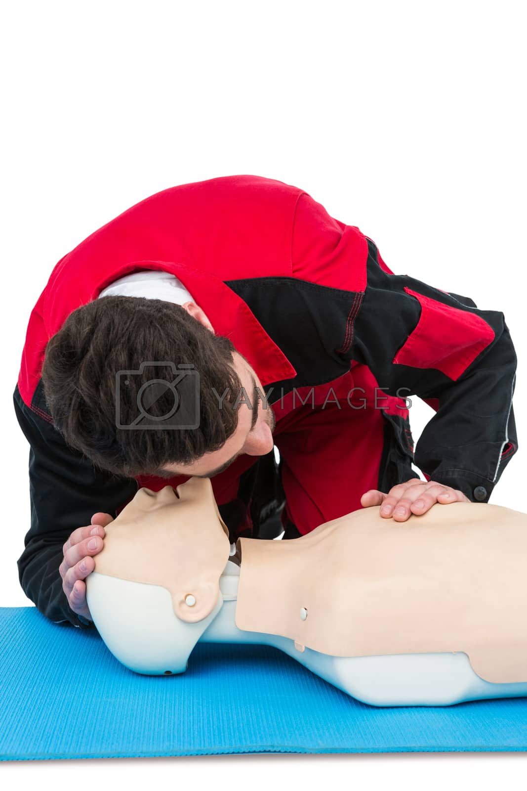 Royalty free image of Paramedic practising resuscitation on dummy by Wavebreakmedia