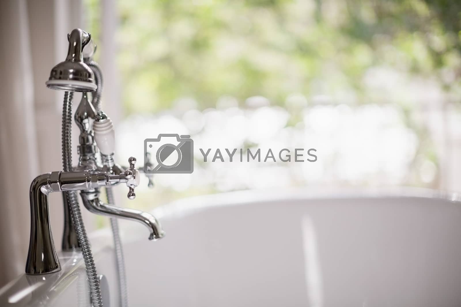 Royalty free image of Close-up of tap with bathtub by Wavebreakmedia
