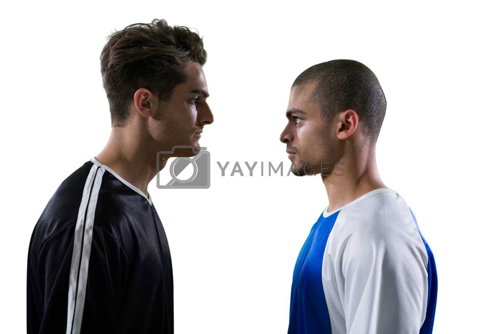 Royalty free image of Two rival football player looking at each other by Wavebreakmedia