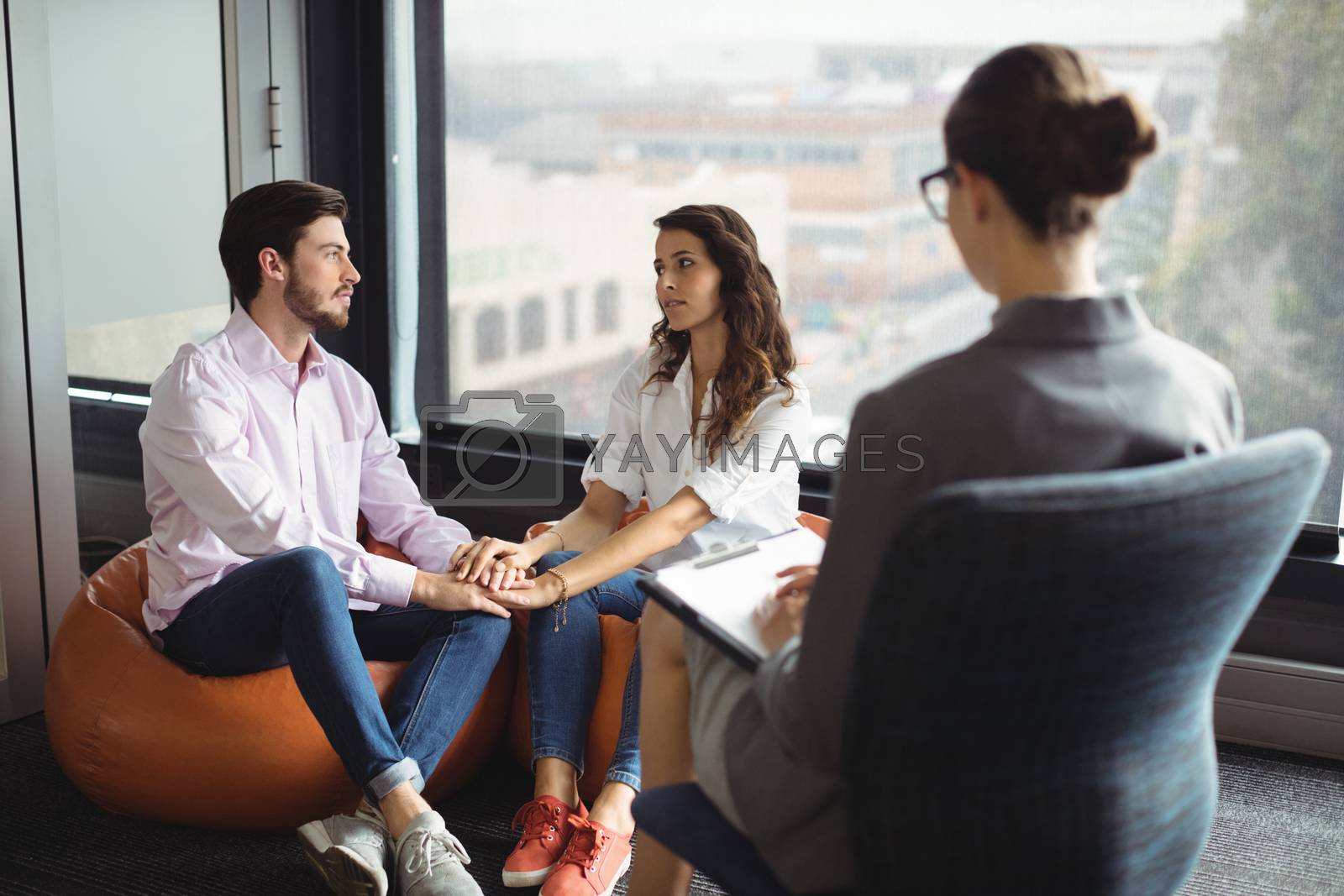 Royalty free image of Couple talking to a marriage counselor by Wavebreakmedia