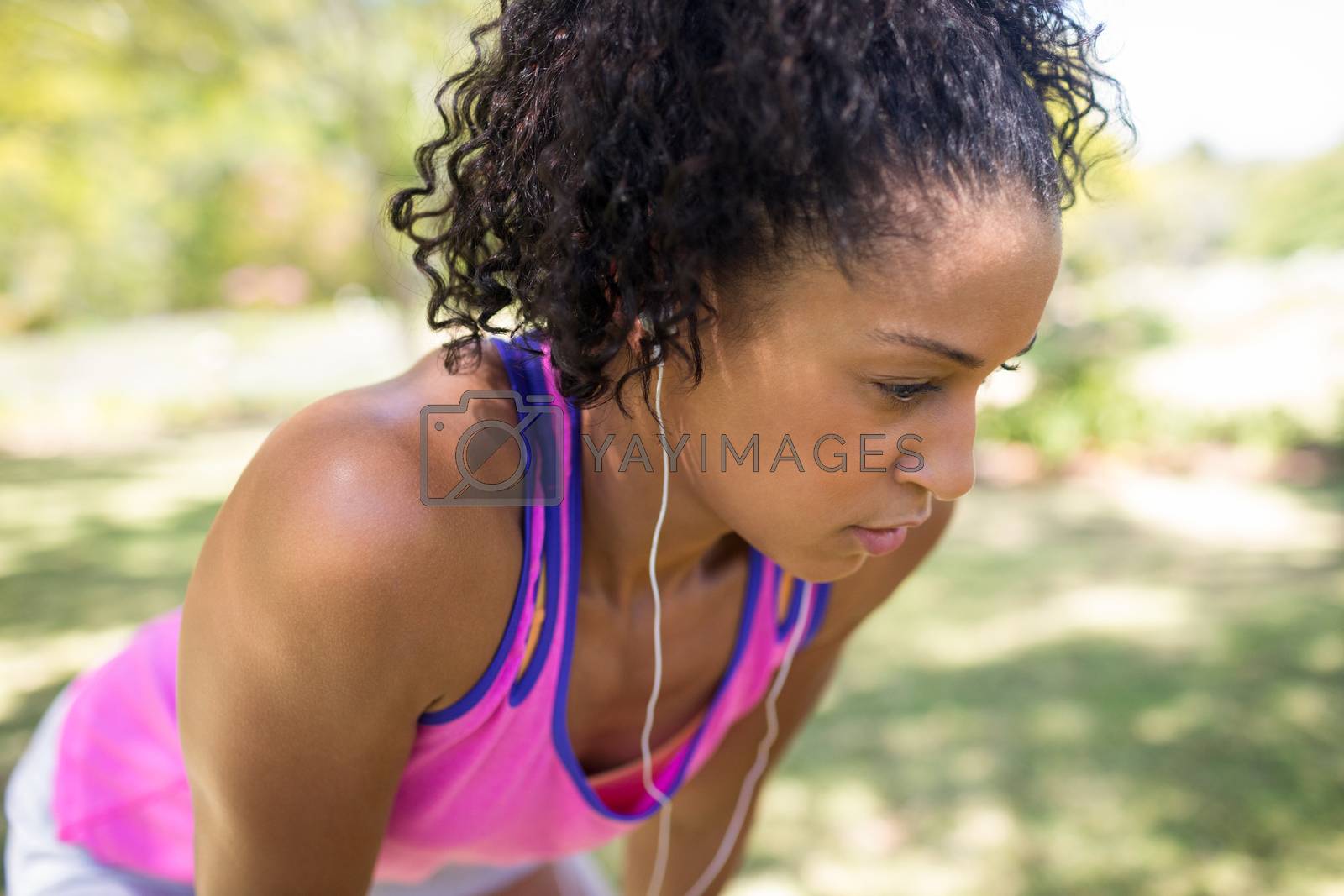 Royalty free image of Exhausted jogger woman relaxing in the park by Wavebreakmedia