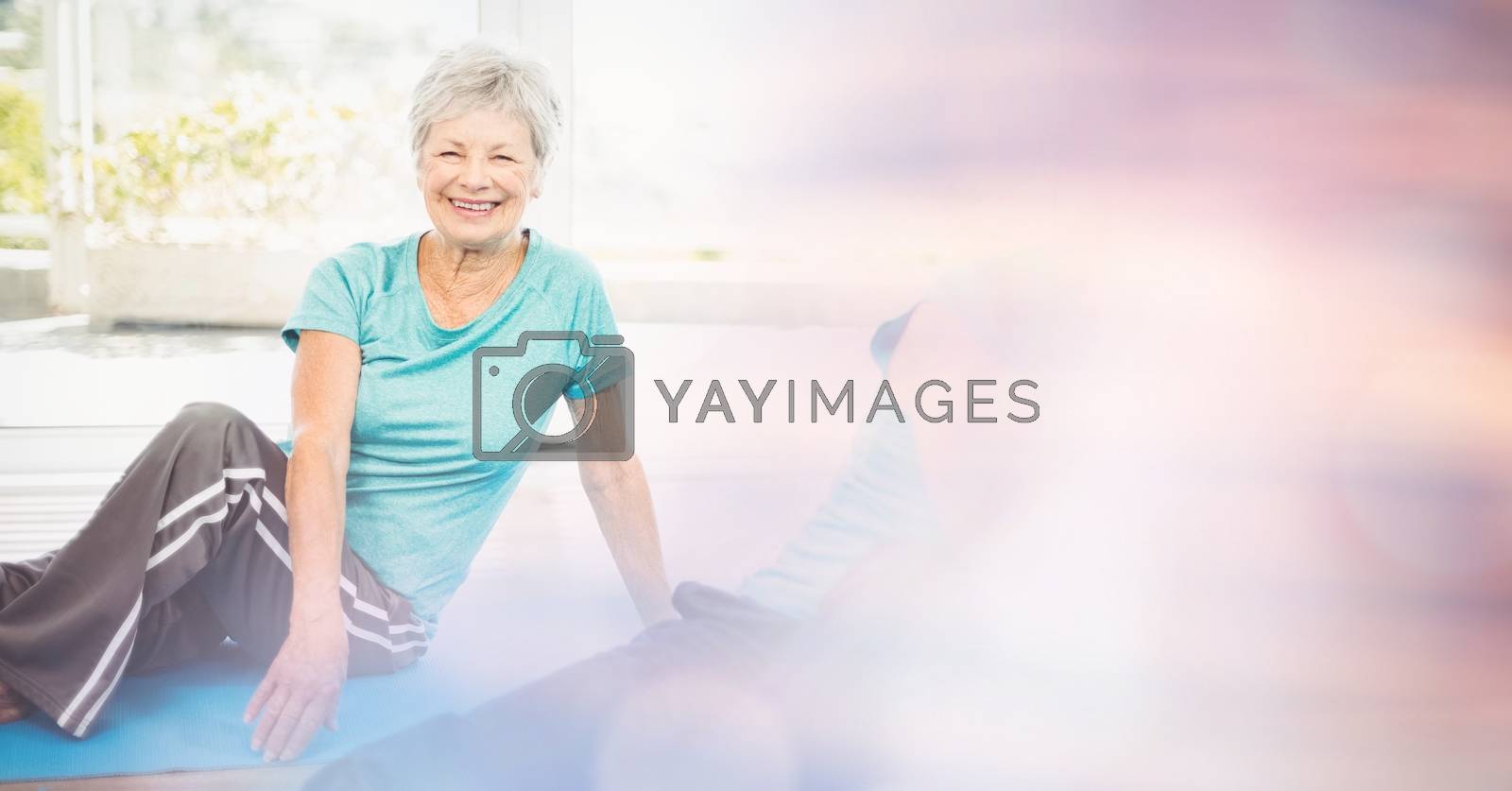 Royalty free image of Fit senior woman exercising in yoga class by Wavebreakmedia