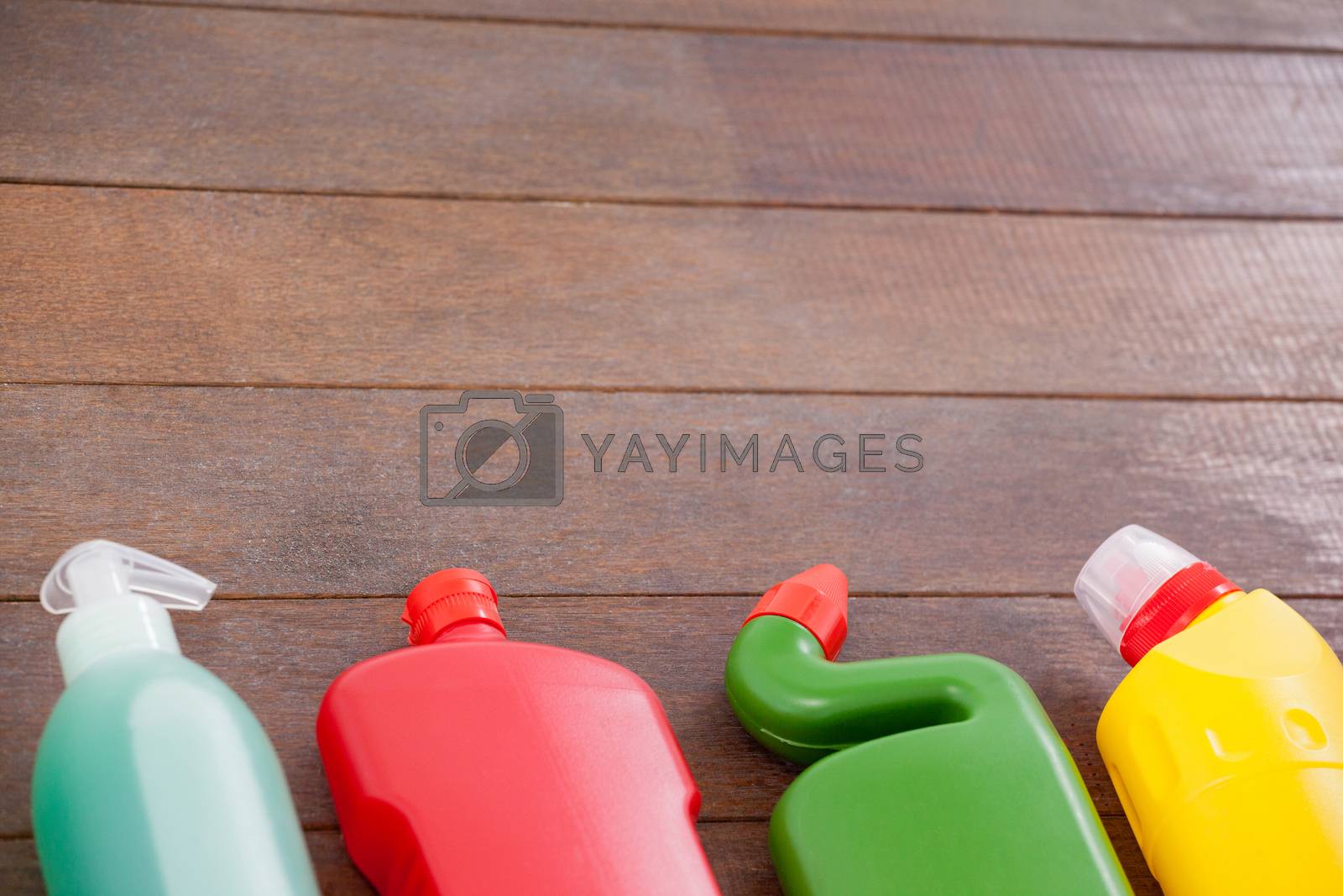 Royalty free image of Detergent bottles arranged on a wooden floor by Wavebreakmedia