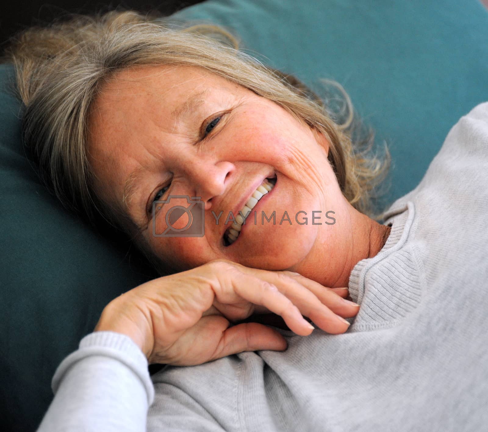 Royalty free image of Mature female in bed. by oscarcwilliams