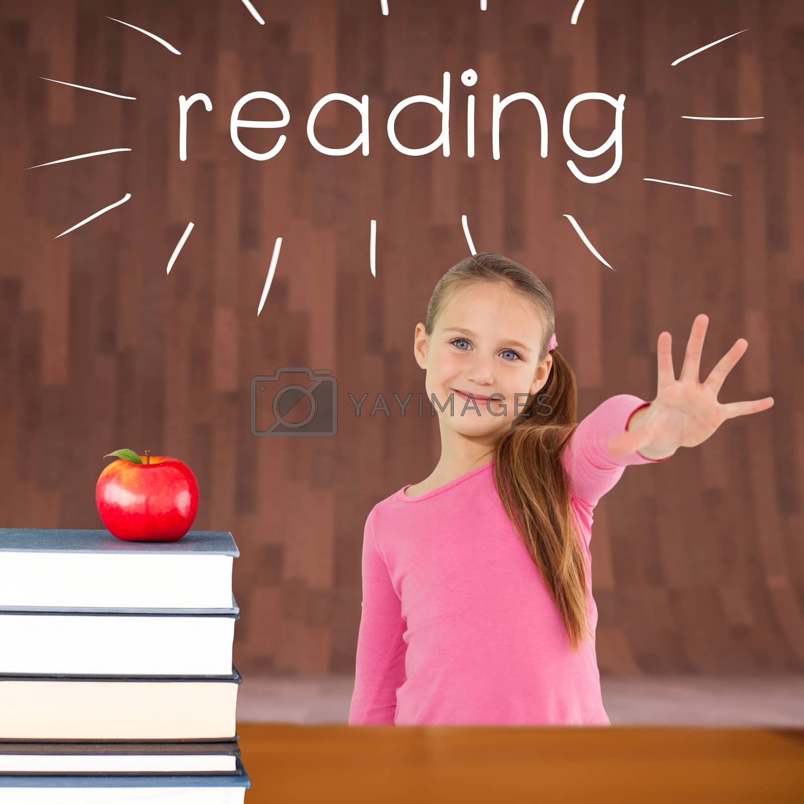Royalty free image of Reading against red apple on pile of books by Wavebreakmedia