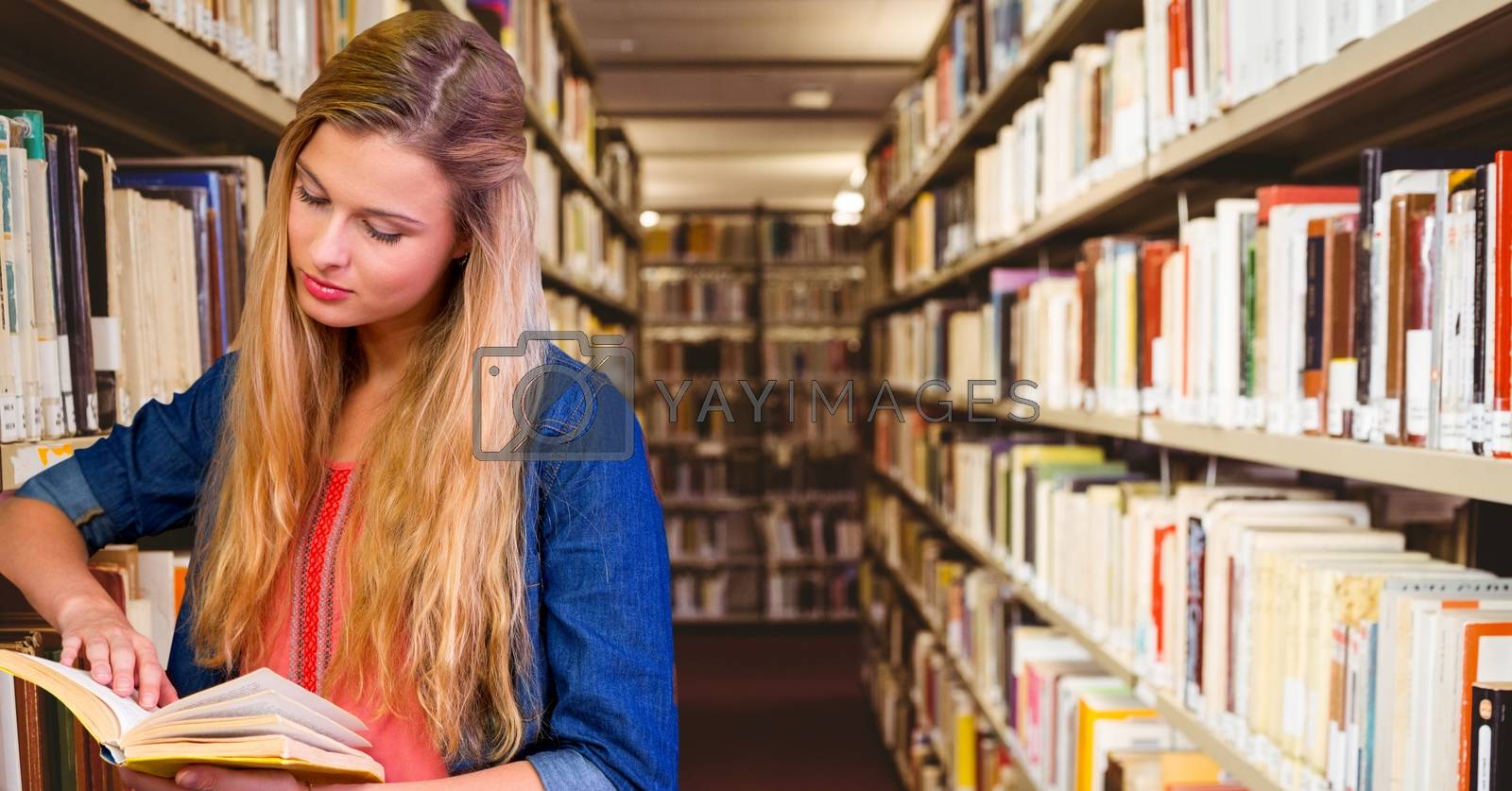 Royalty free image of Student woman in education library by Wavebreakmedia