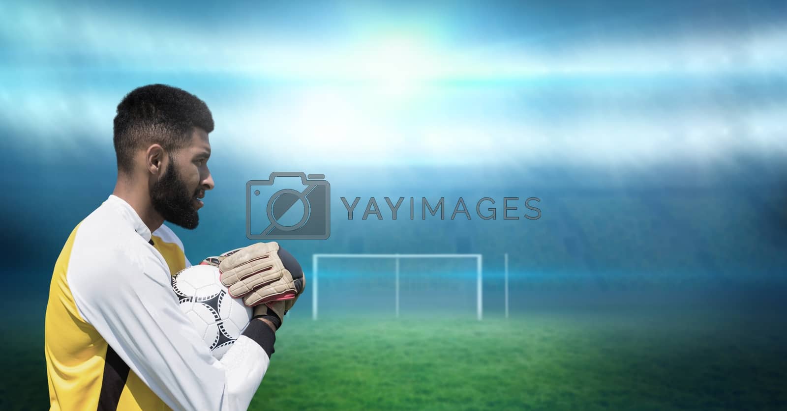 Royalty free image of Soccer goalkeeper holding football by Wavebreakmedia