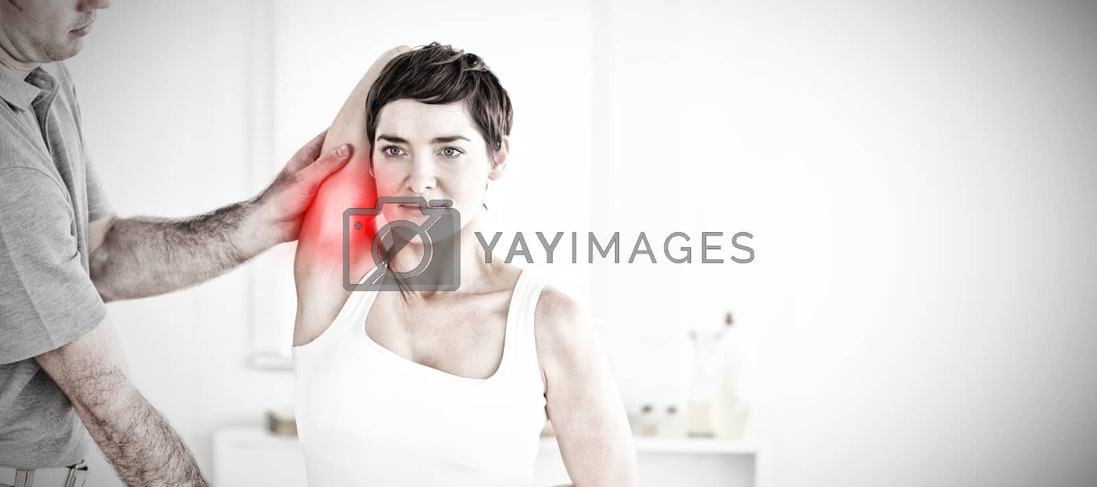 Royalty free image of Composite image of charming patient doing some exercises under supervision by Wavebreakmedia