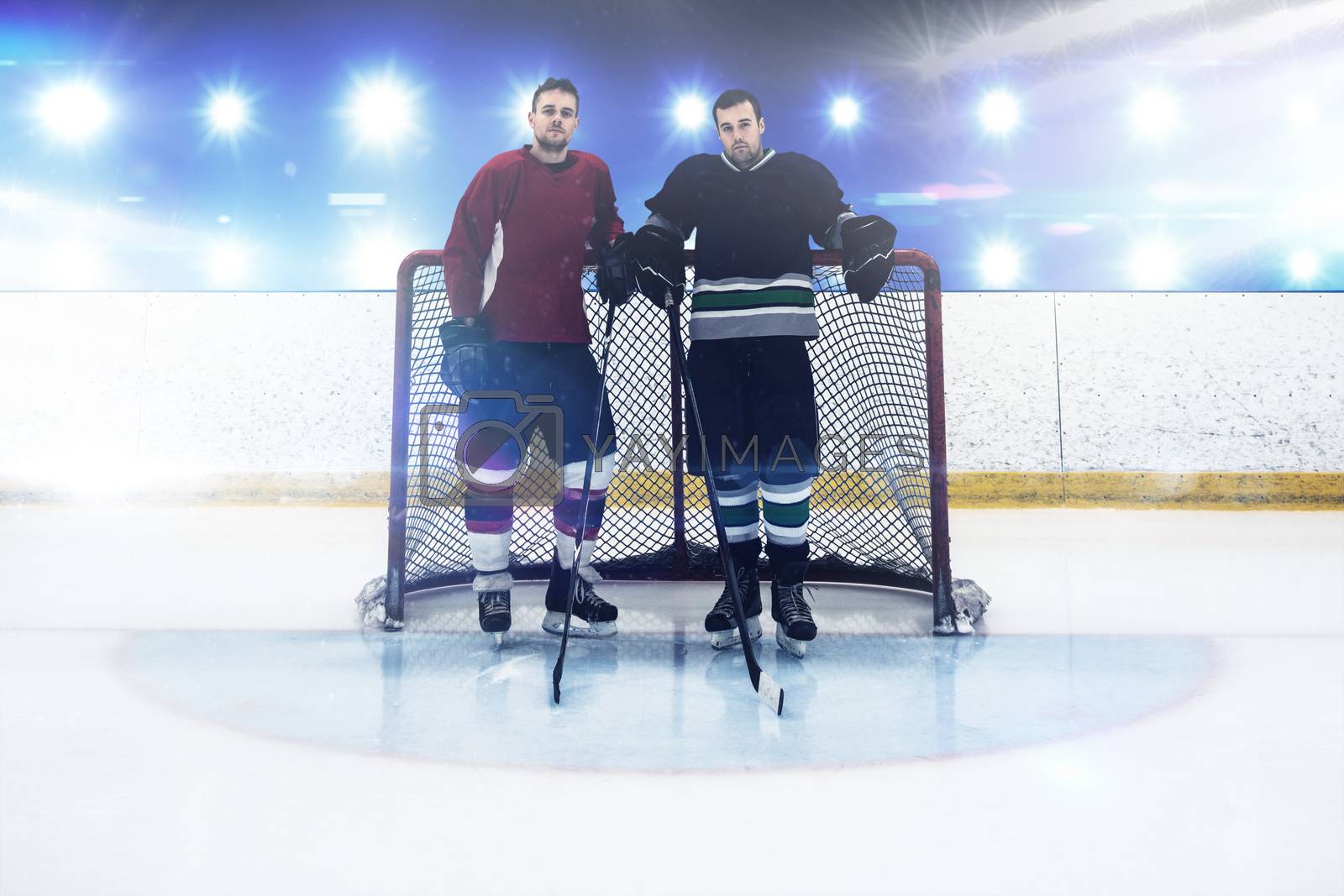 Royalty free image of Composite image of ice hockey players standing by goal post by Wavebreakmedia