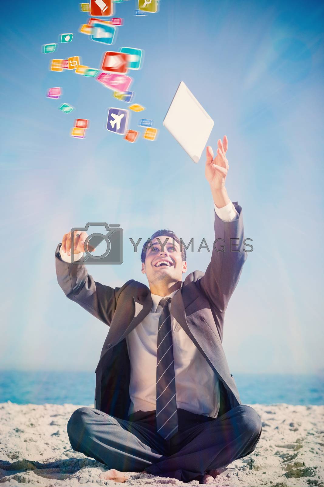 Royalty free image of Composite image of victorious young businessman juggling with his tablet  by Wavebreakmedia