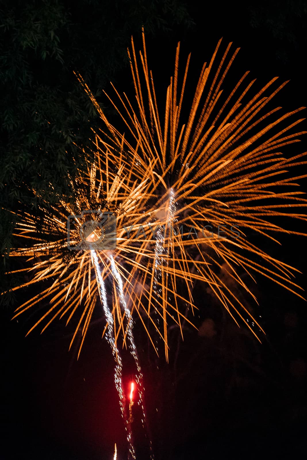 Royalty free image of fiery pieces of a fire show by Andreua