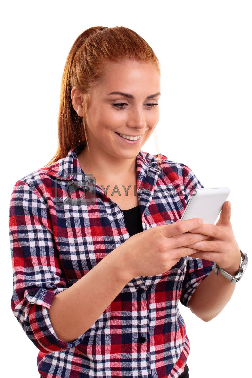 Royalty free image of Beautiful smiling young woman looking at mobile phone by Mendelex