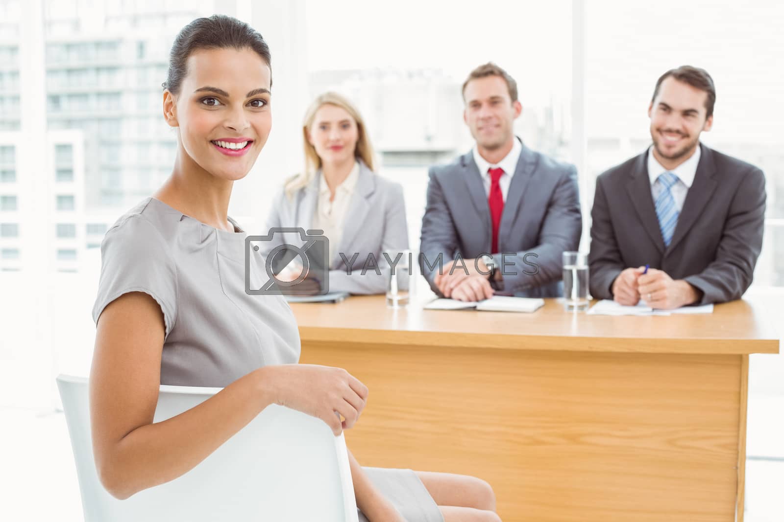 Royalty free image of Woman in front of corporate personnel officers by Wavebreakmedia