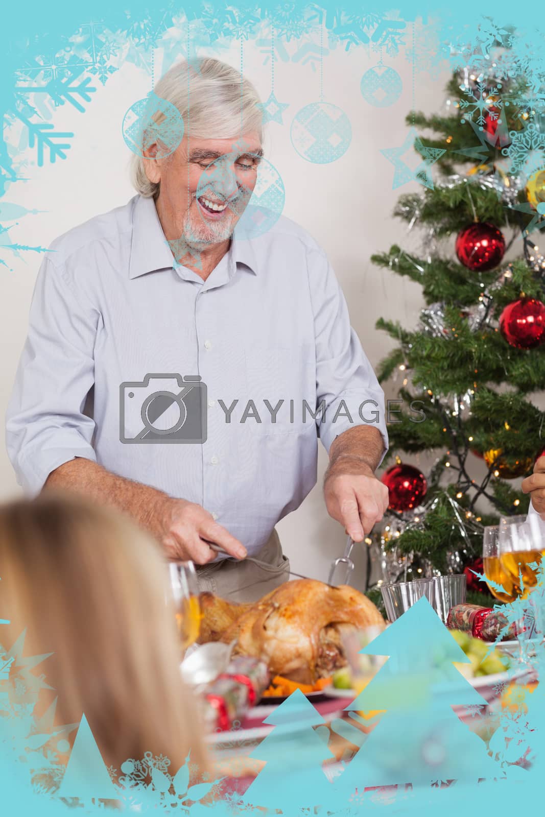Royalty free image of Grandfather carving a christmas turkey by Wavebreakmedia