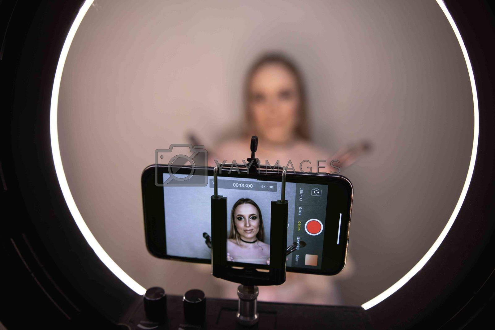 Royalty free image of  Beauty blogger recording makeup tutorial video at home by tadeush89