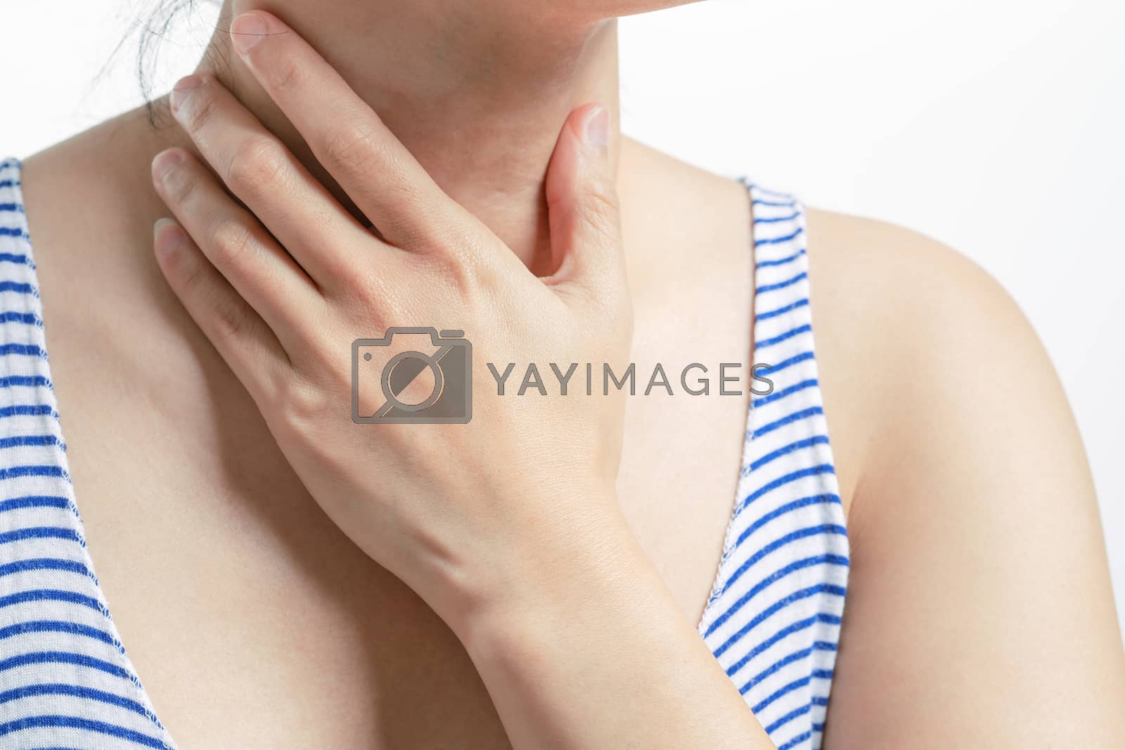 Royalty free image of Sore throat pain women. Woman hand touching neck with sore throa by psodaz