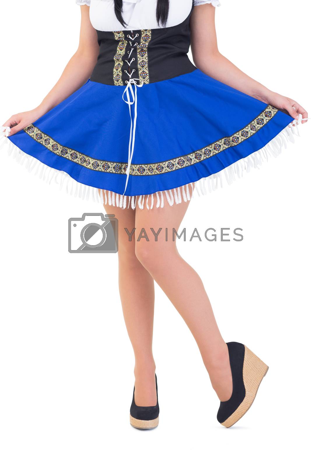 Royalty free image of Oktoberfest girl spreading her skirt by Wavebreakmedia